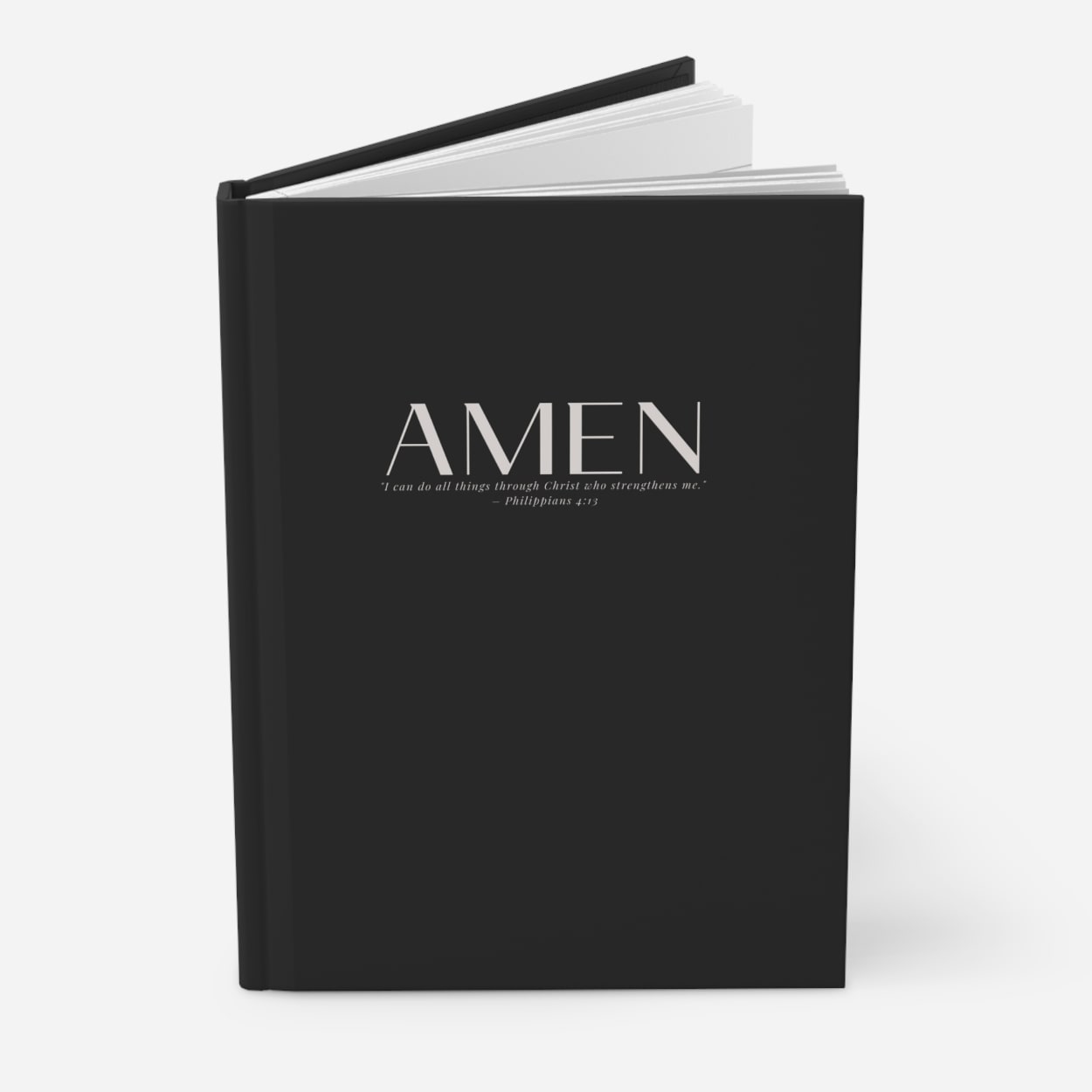 Modern black hardcover AMEN journal for prayer, reflection, and goal setting.