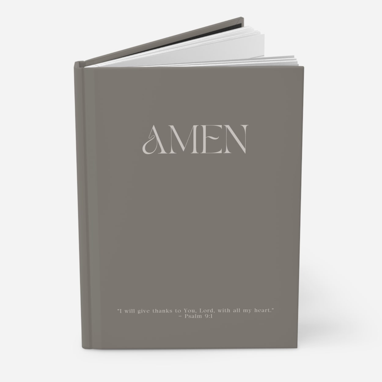 Moss gray AMEN journal standing upright, highlighting elegant cover and sophisticated profile
