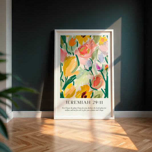 floral illustration with Jeremiah 29:11 scripture, in a white frame leaning against a navy wall