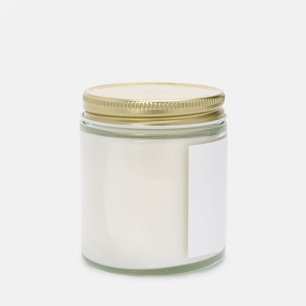 Side of clear jar Christian vegan candle.