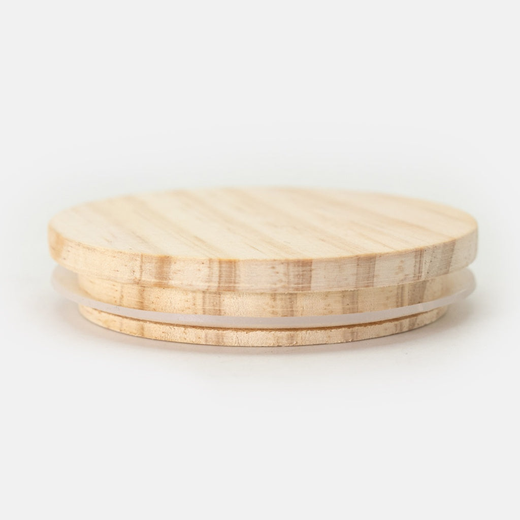 Luxury soy candle in frosted glass with a wooden lid with a pink wick and Bible verse.
