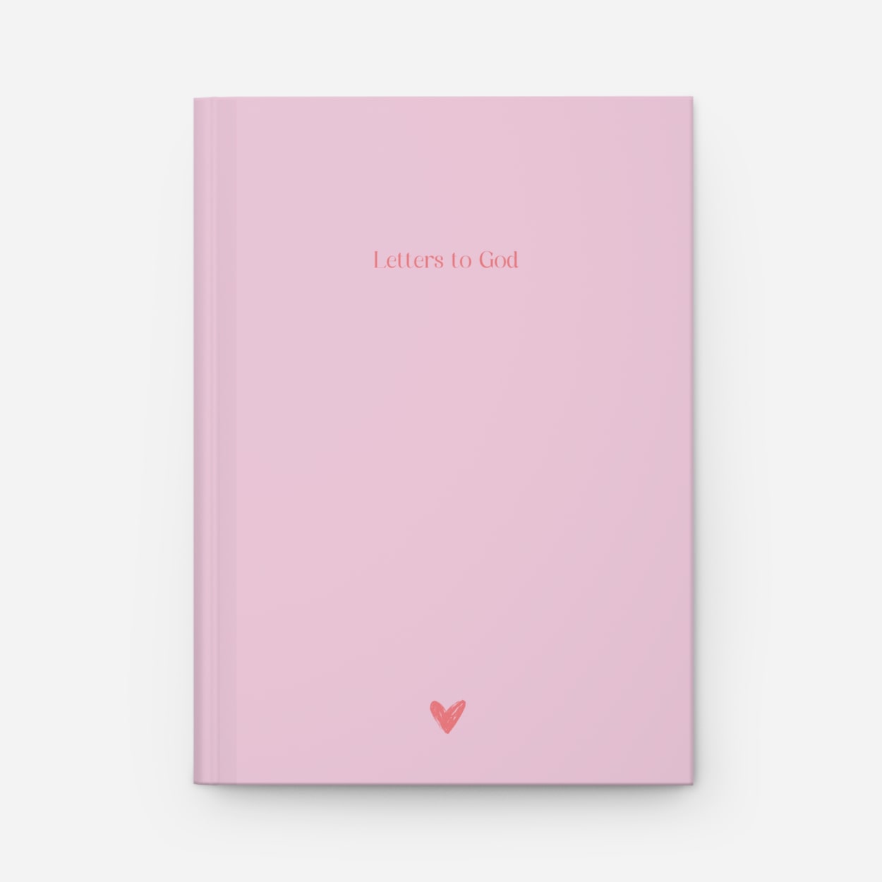Detailed view of blush pink journal cover with minimalist faith-inspired design