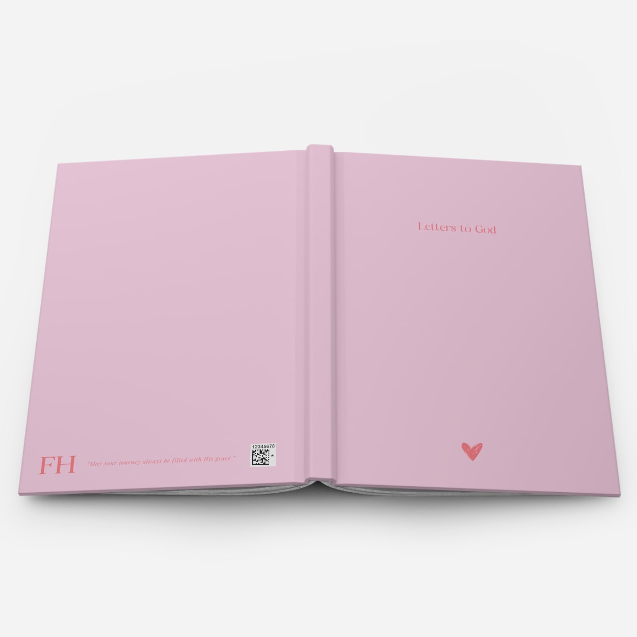 an open Christian journal in blush pink showing the full cover front and back