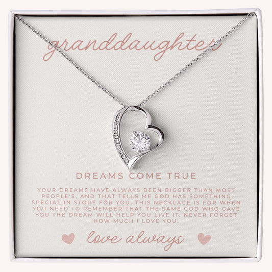 Heart-shaped necklace with a diamond pendant in a gift box labeled 'granddaughter'.