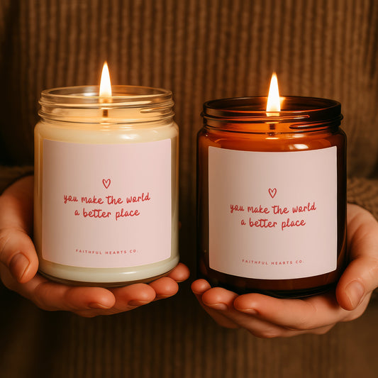 You make the world a better place faith candle with pink heart label in clear and amber glass jars