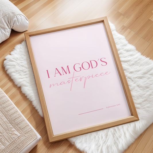 I Am God's Masterpiece Christian affirmation wall art print with soft blush pink background, coral pink serif text reading 'I am God's' and rose pink script text reading 'masterpiece', faith-based encouragement decor