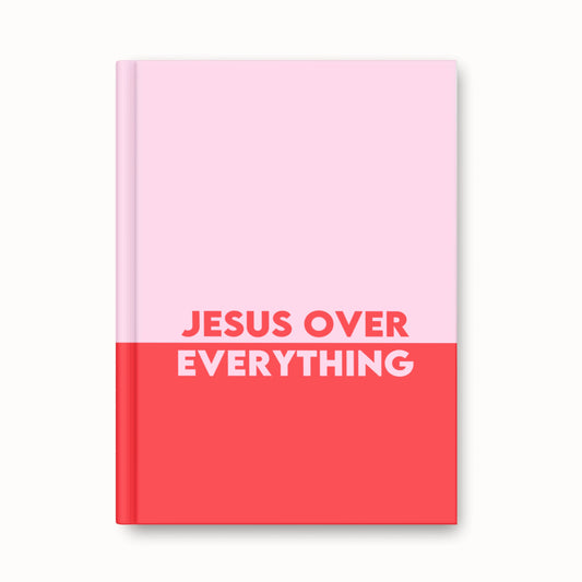 Bold pink and red hardback journal with “Jesus Over Everything” text on the cover — Faithful Hearts Co.