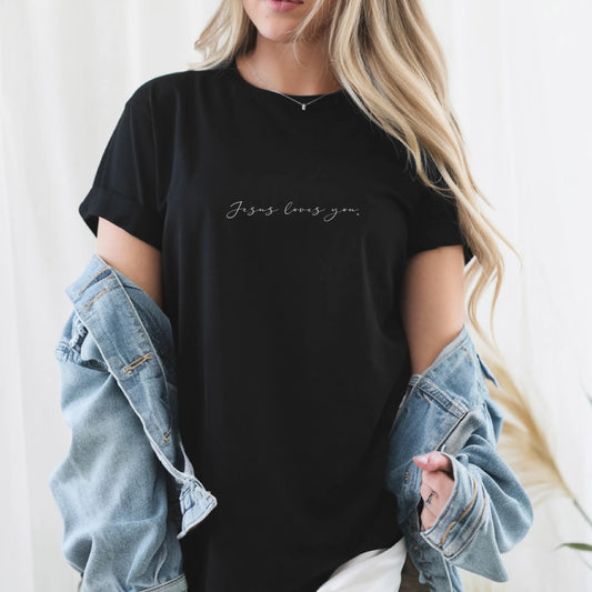 Women’s black Christian T-shirt with "Jesus Loves You." script font