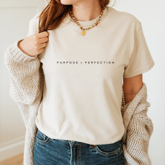 Women’s ivory faith-based T-shirt featuring "Purpose Over Perfection" design