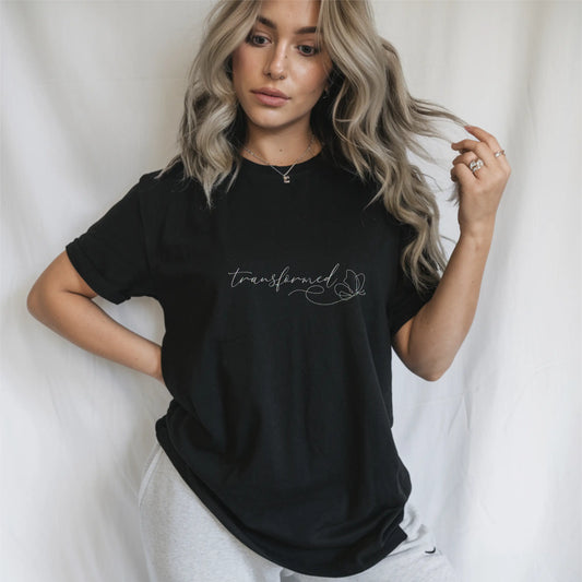 Women’s black Christian T-shirt with "Transformed" text and butterfly line art