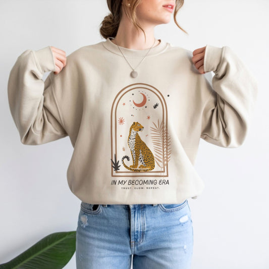 In My Becoming Era sweatshirt in white with boho cheetah arch design, women's spiritual crewneck apparel