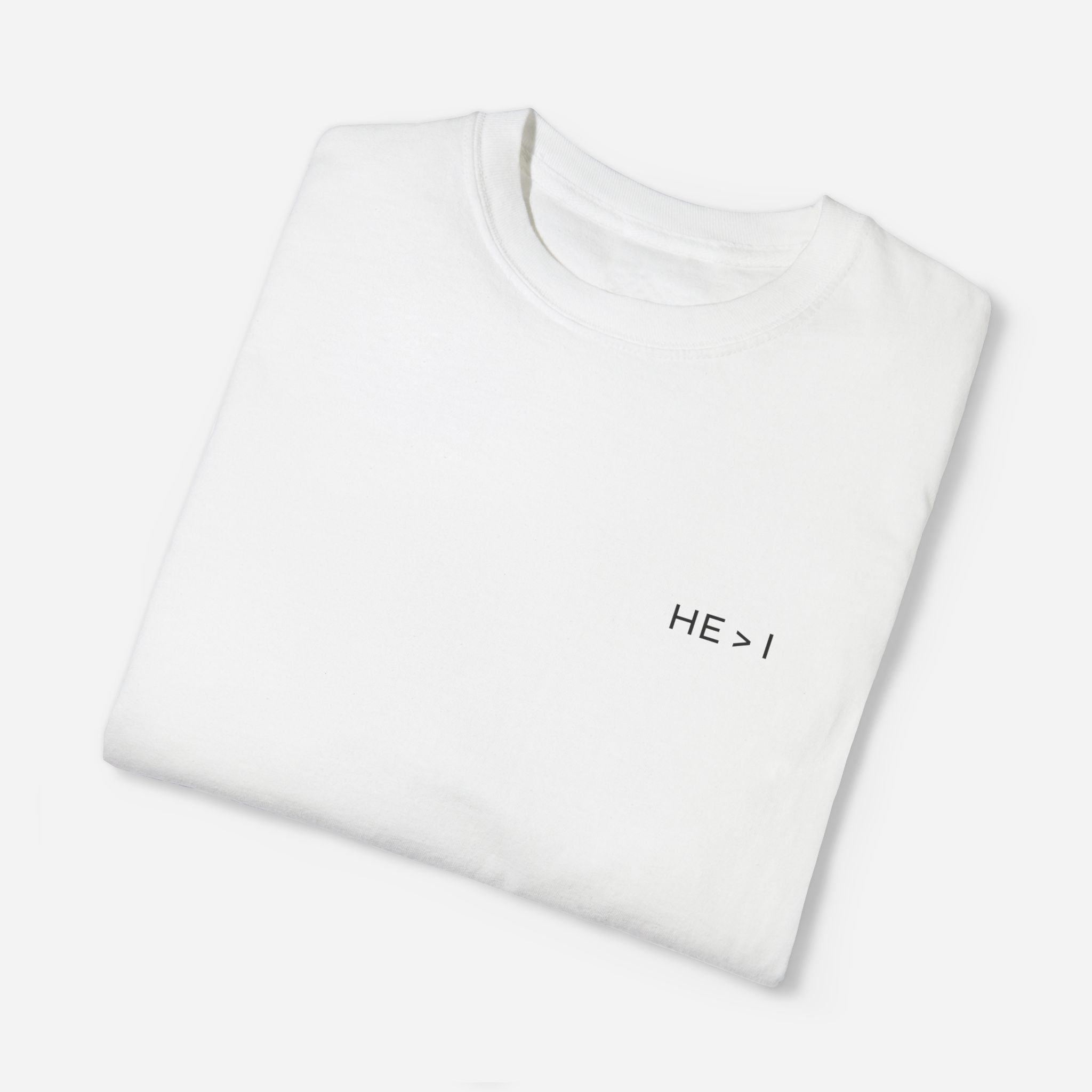 White t-shirt folded showing a close up of the print 'he>I'.