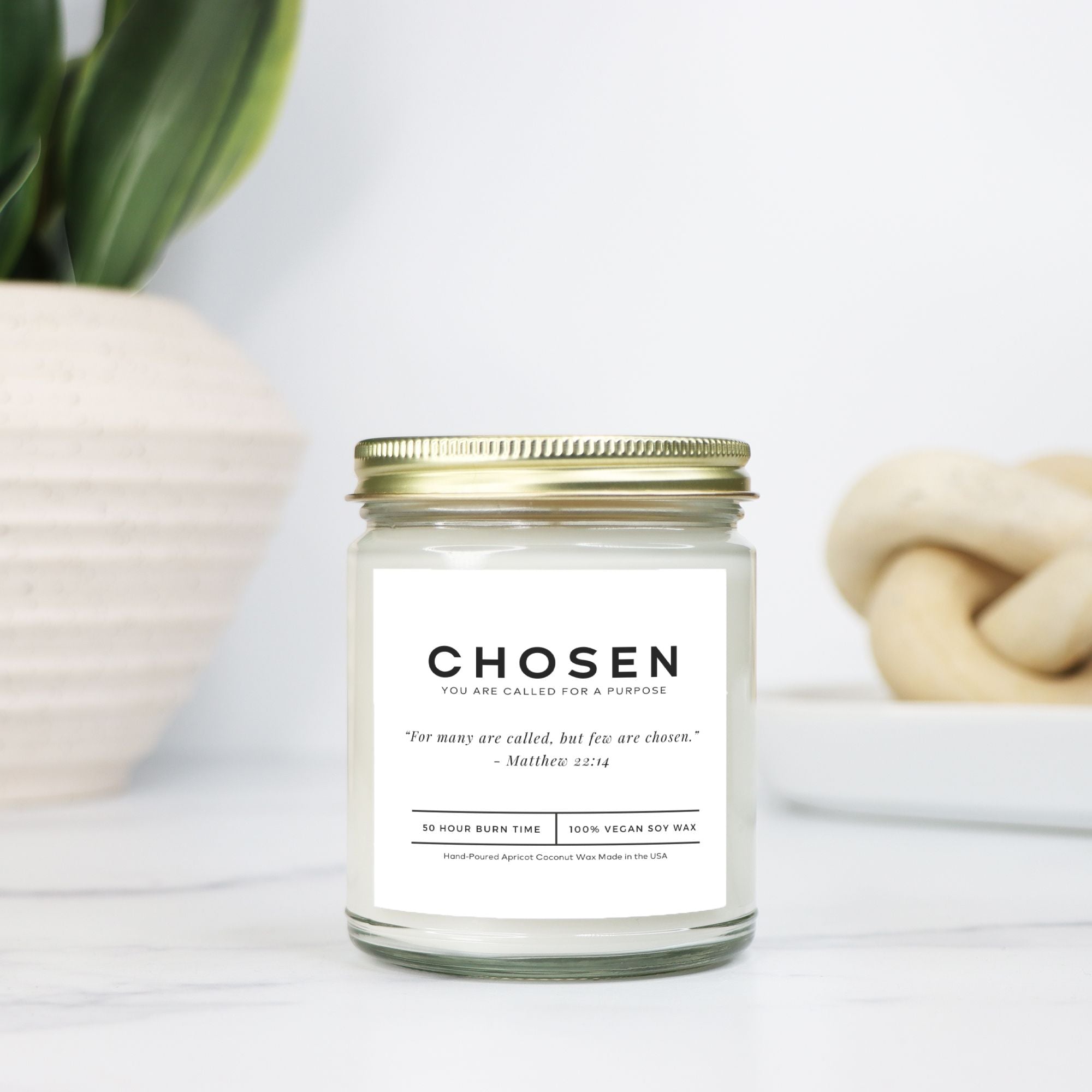 Luxury soy candle with an inspiring Bible verse label, creating a peaceful atmosphere.