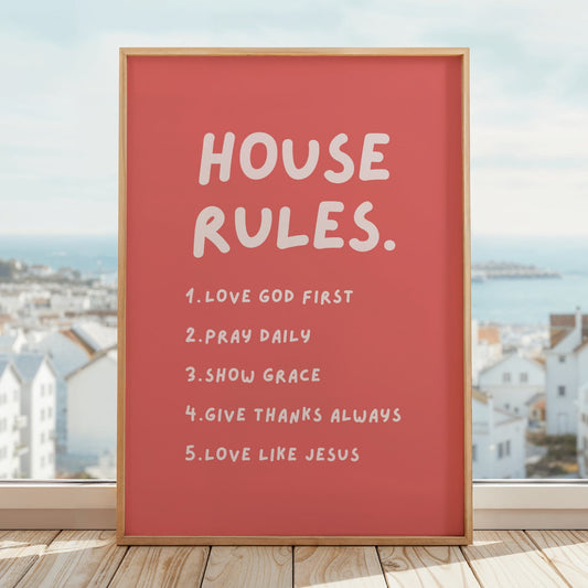 House Rules Christian wall art print with warm coral pink background and soft blush pink handwritten text listing five faith values: Love God First, Pray Daily, Show Grace, Give Thanks Always, Love Like Jesus