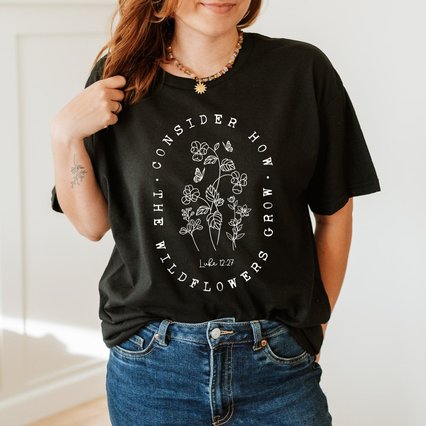 Wildflowers - Luke 12:27 - Christian T-shirt - Black