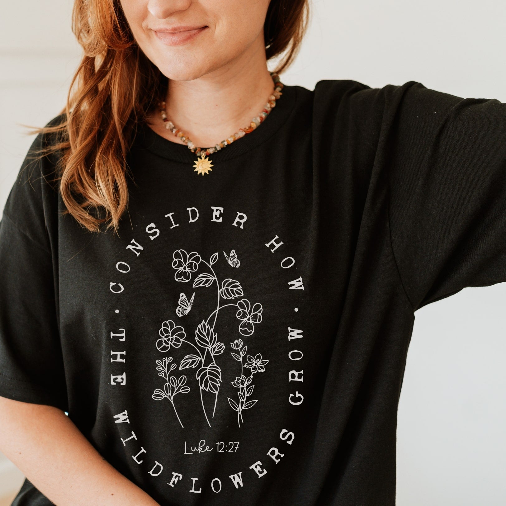Wildflowers - Luke 12:27 - Christian T-shirt - Black