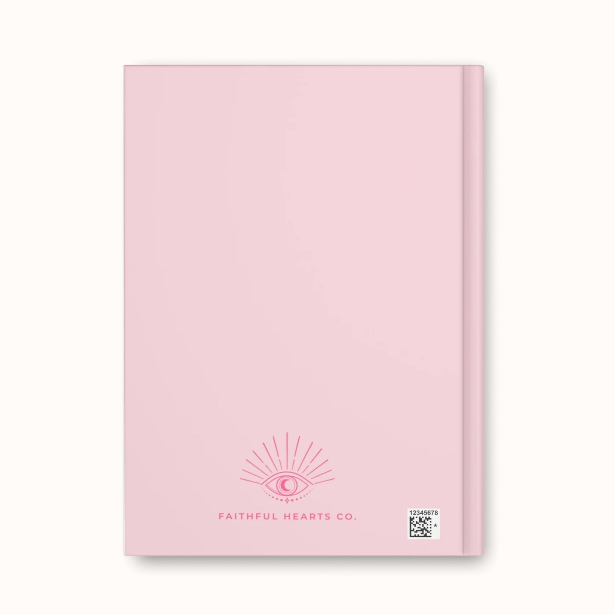 Back cover of Aligned & Abundant journal showing Faithful Hearts Co. branding with delicate eye symbol detail on soft pink background