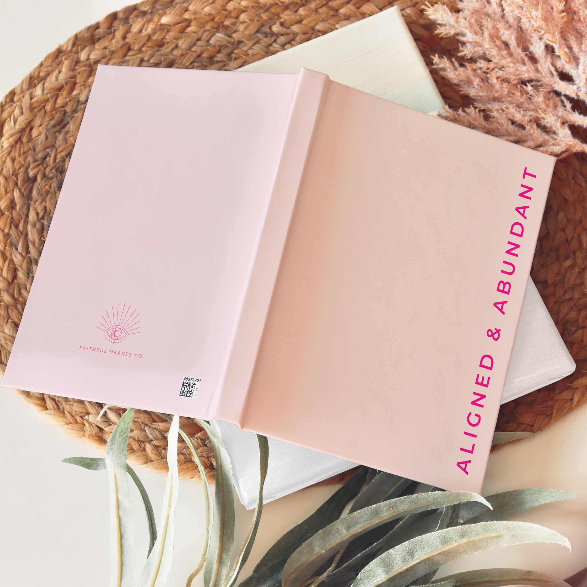 Soft pink hardback notebook with divine eye design and 