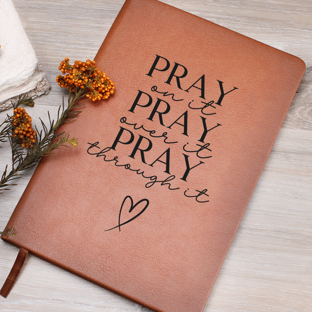 Vegan leather journal featuring the words Pray on it