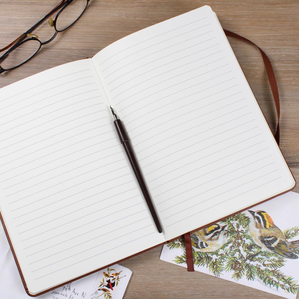 Open journal showing lined pages, perfect for prayer writing and reflection.