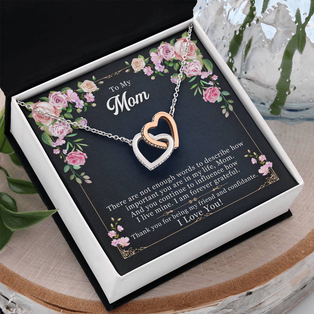 silver colored necklace gift for mom with message card inside the gift box.