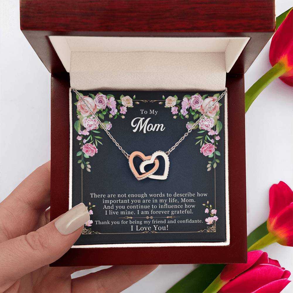 necklace gift being held to show the message card inside that says to my mom