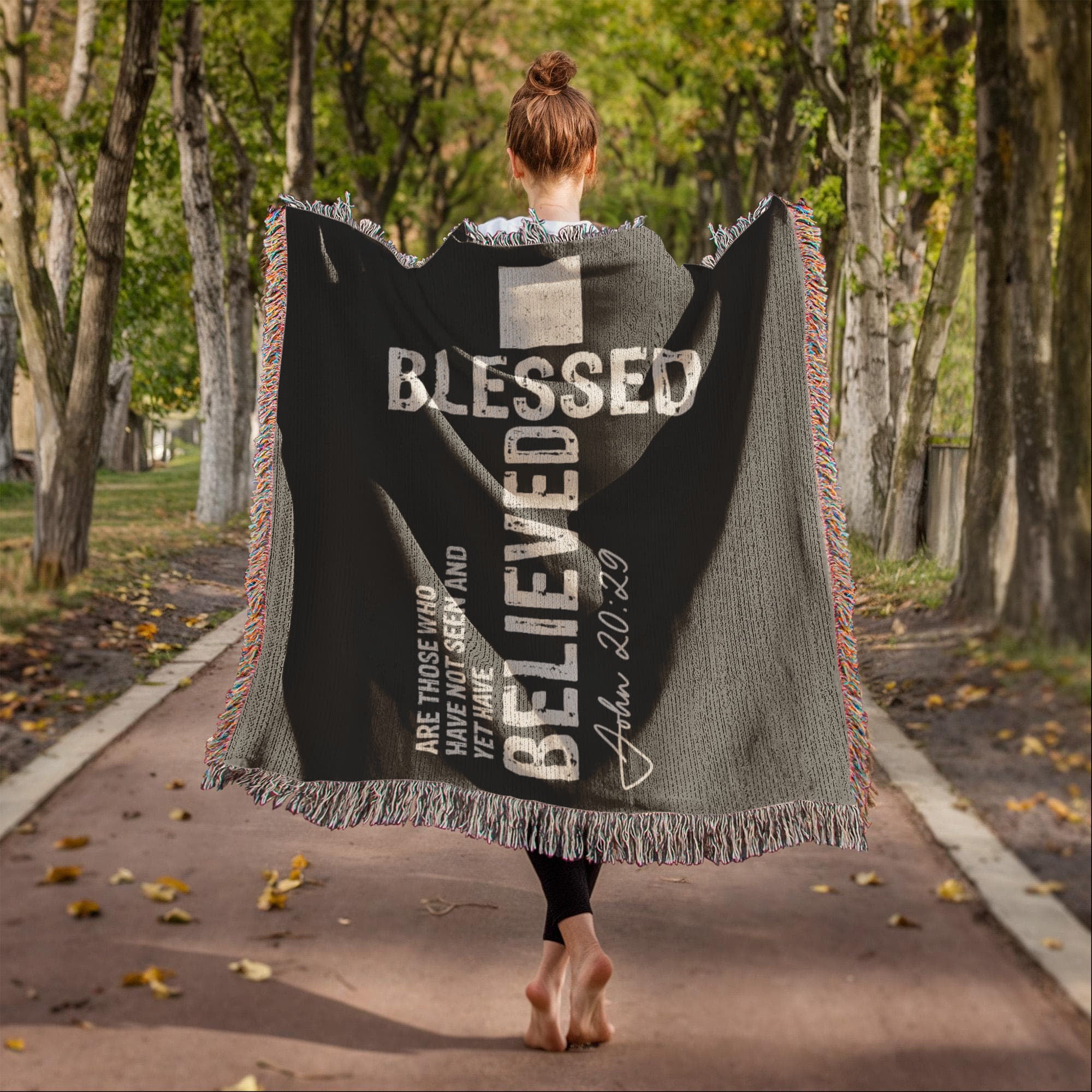Faith-inspired woven blanket featuring John 20:29 scripture verse in elegant dark gray fabric.
