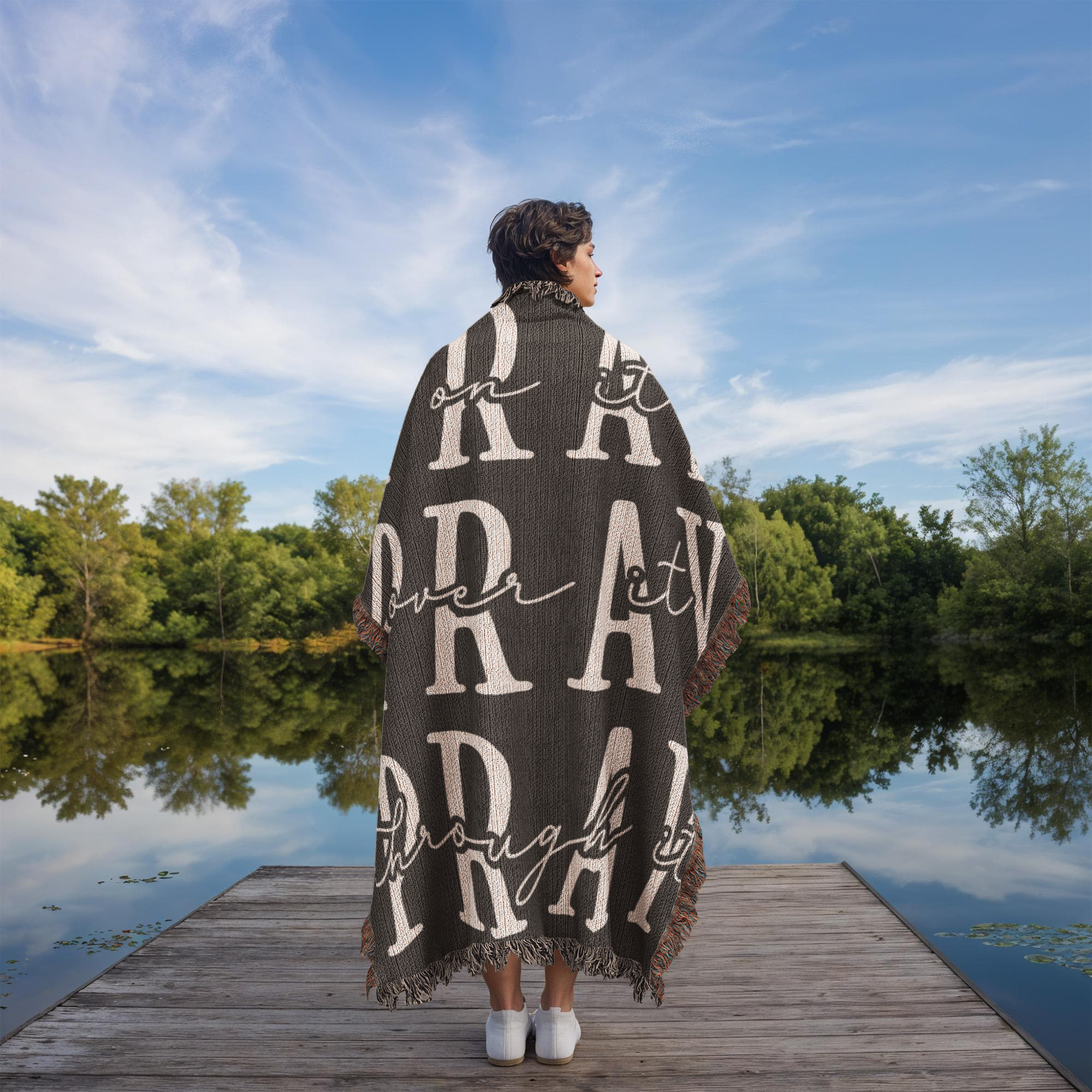 luxury woven blanket with pray written on it.