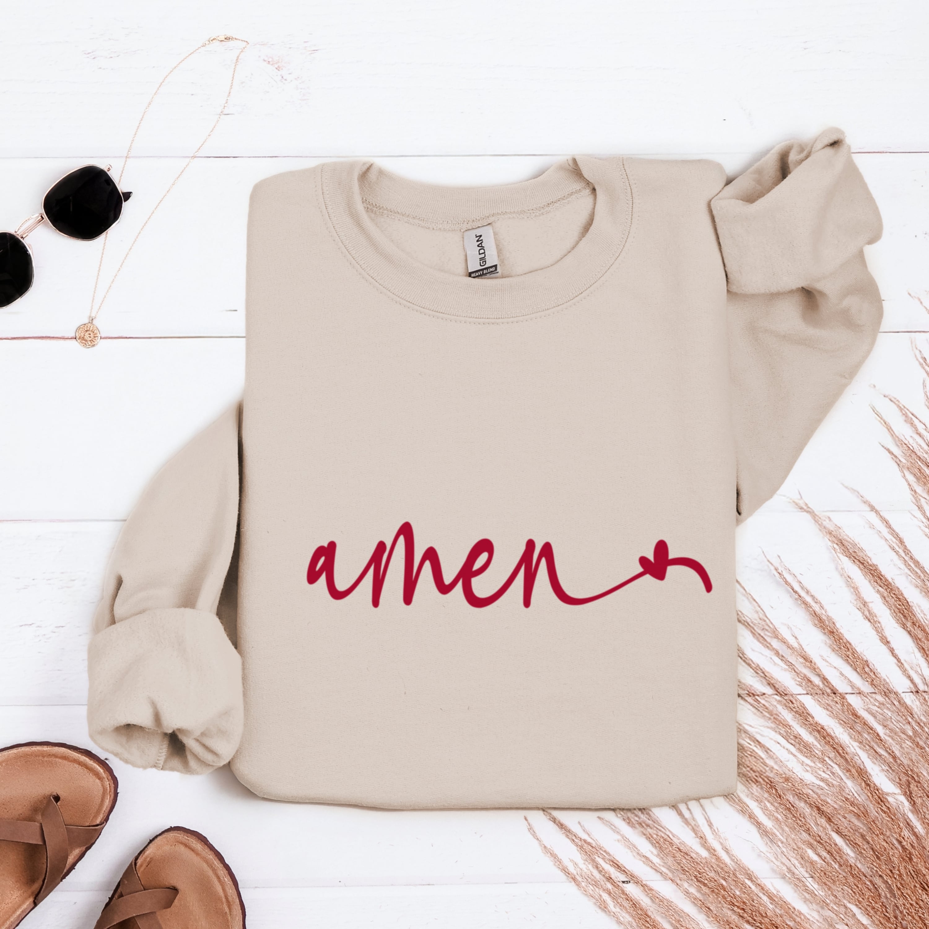 Cream Amen heart sweatshirt flat lay with neutral accessories - simple minimalist Christian apparel for women