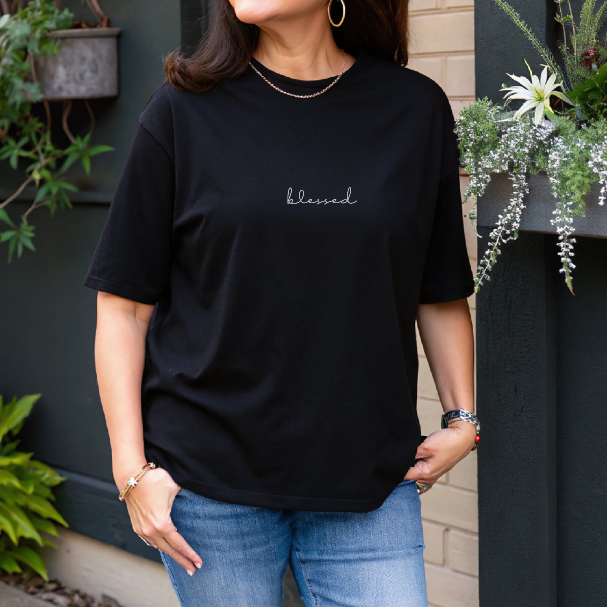Faith-inspired black T-shirt for women featuring 