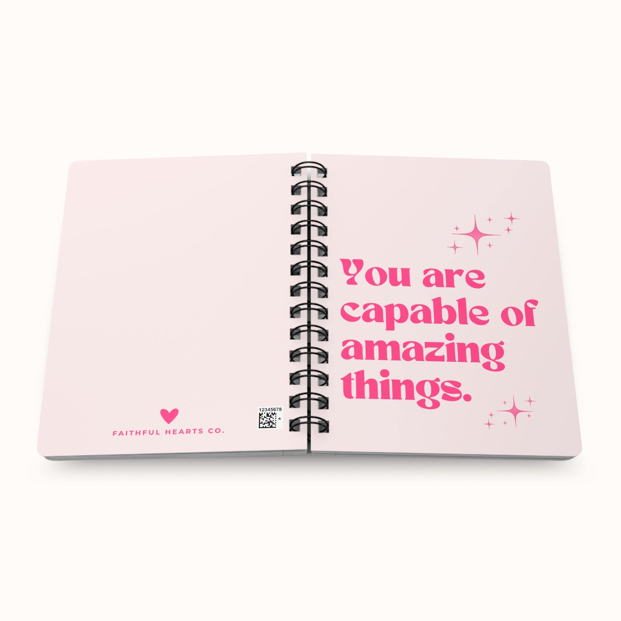 Motivational spiral notebook in soft pink with sparkling hot pink text, perfect for journaling, branded Faithful Hearts Co.