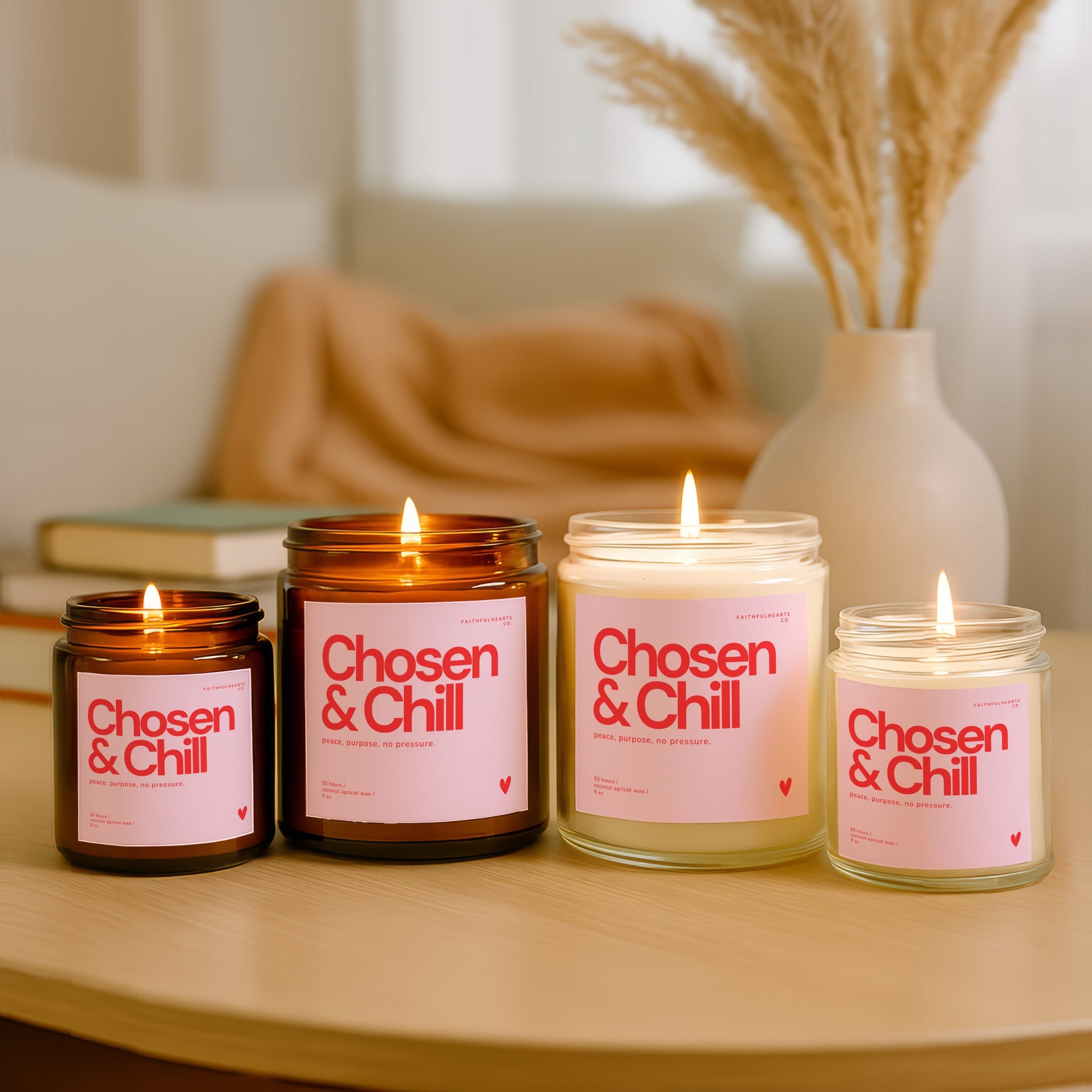 Amber jar and clear jar candles with modern pink and red label, faith-inspired scented candle, coconut apricot wax, handcrafted in USA.