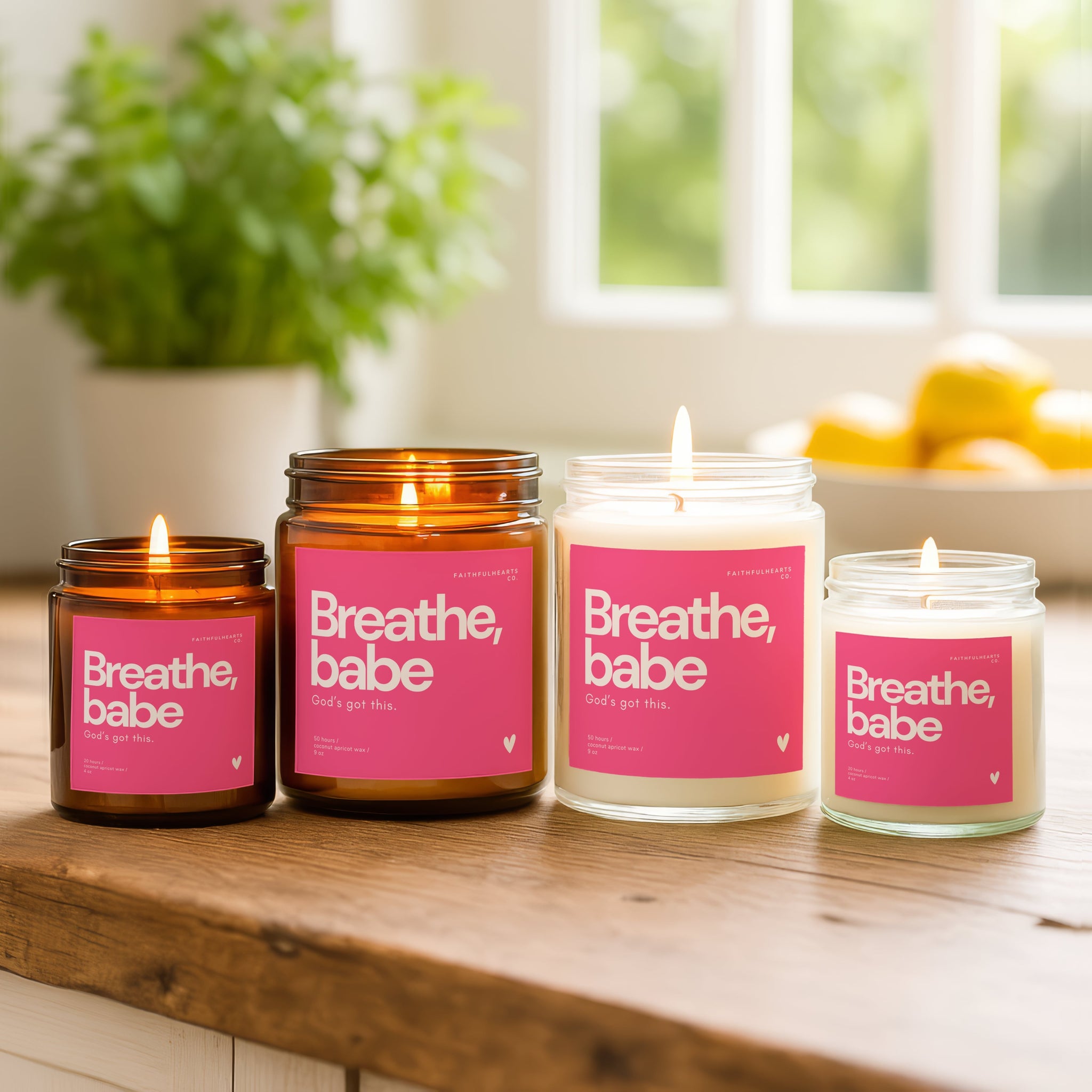 Faithful Hearts Breathe, babe. God’s got this. candle collection, clear and amber jars with bright pink labels, handmade Christian candles promoting peace and trust in God.