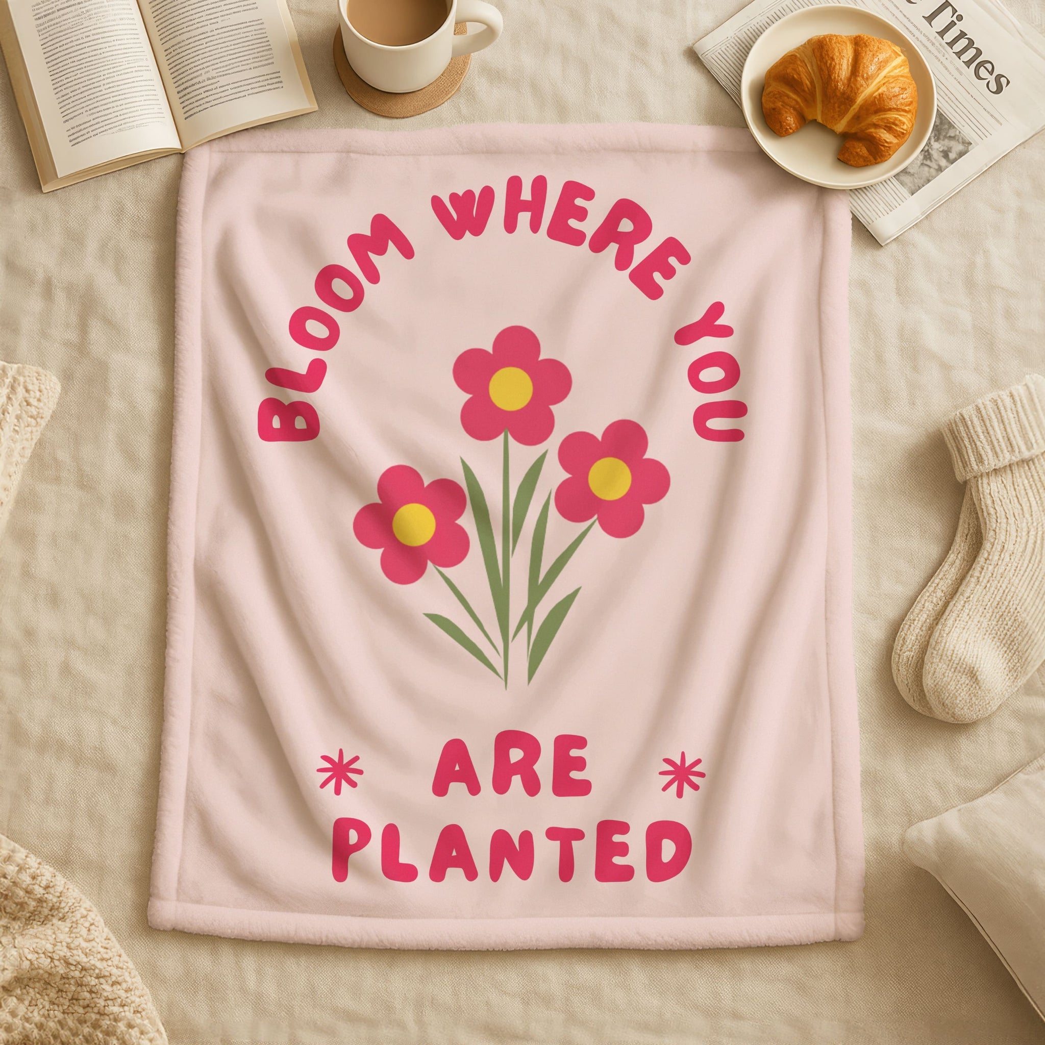 Pink Christian blanket with floral design and Bloom Where You Are Planted inspirational text