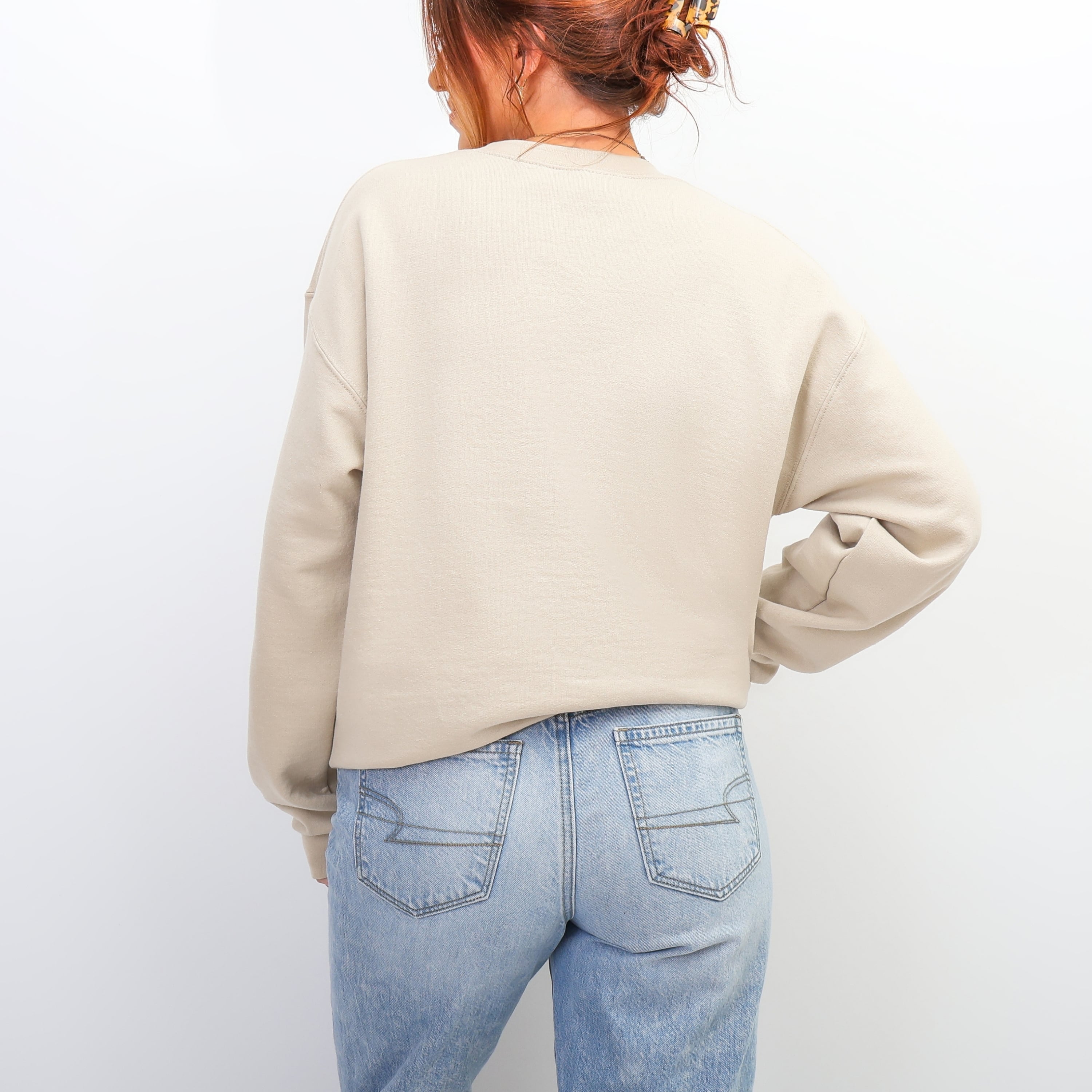 Back view of cream You Are Magical sweatshirt - oversized inspirational crewneck for women