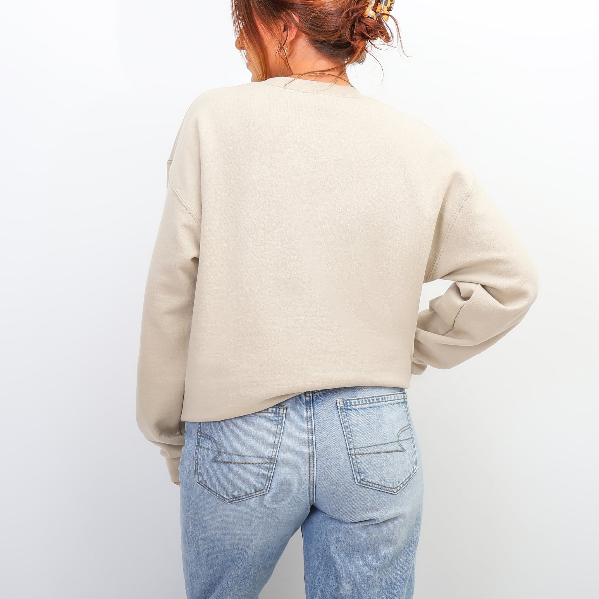 Back view of cream You Are Magical sweatshirt - oversized inspirational crewneck for women