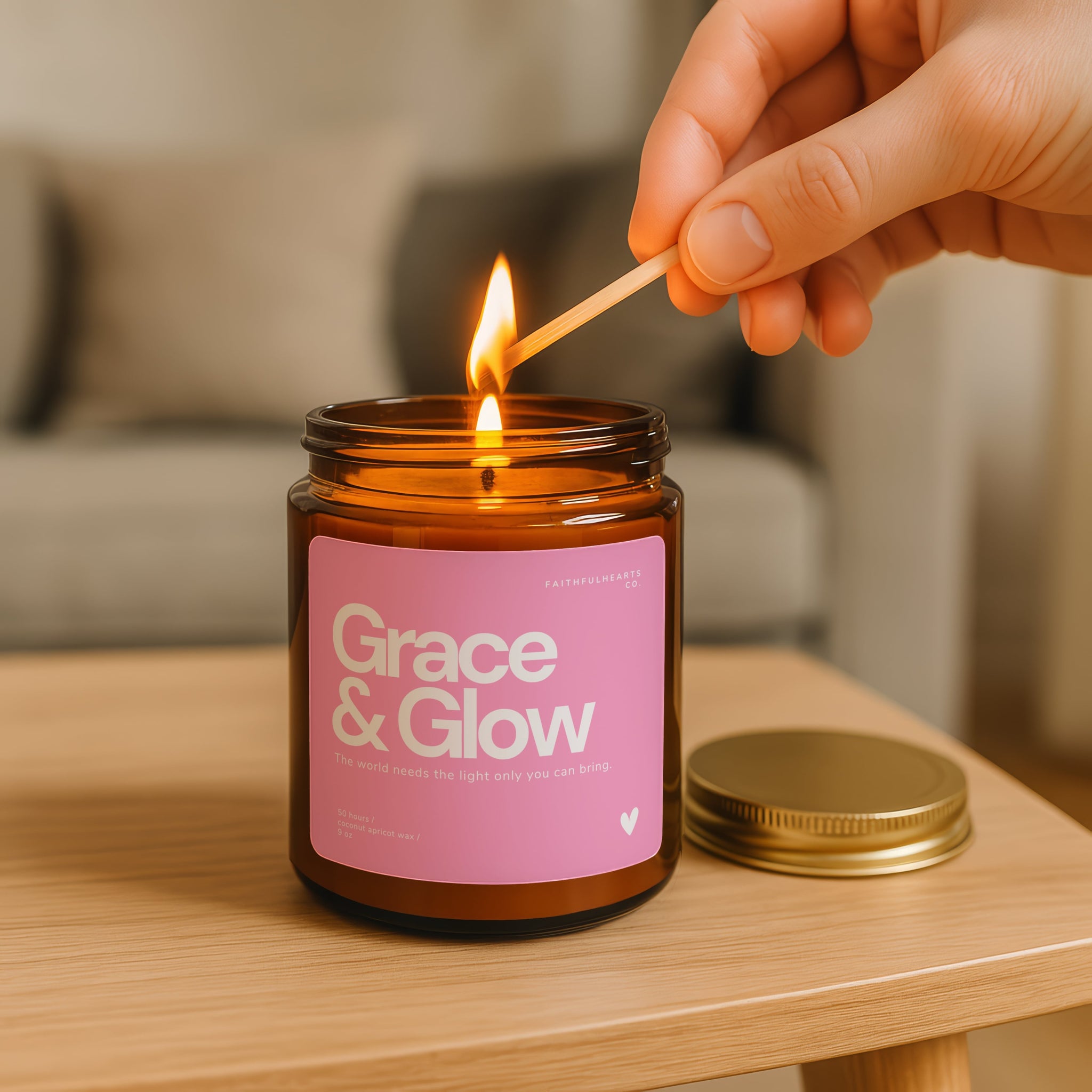Grace & Glow motivational candle in amber jar, pink label design for women embracing faith, mindfulness, and soft life living.