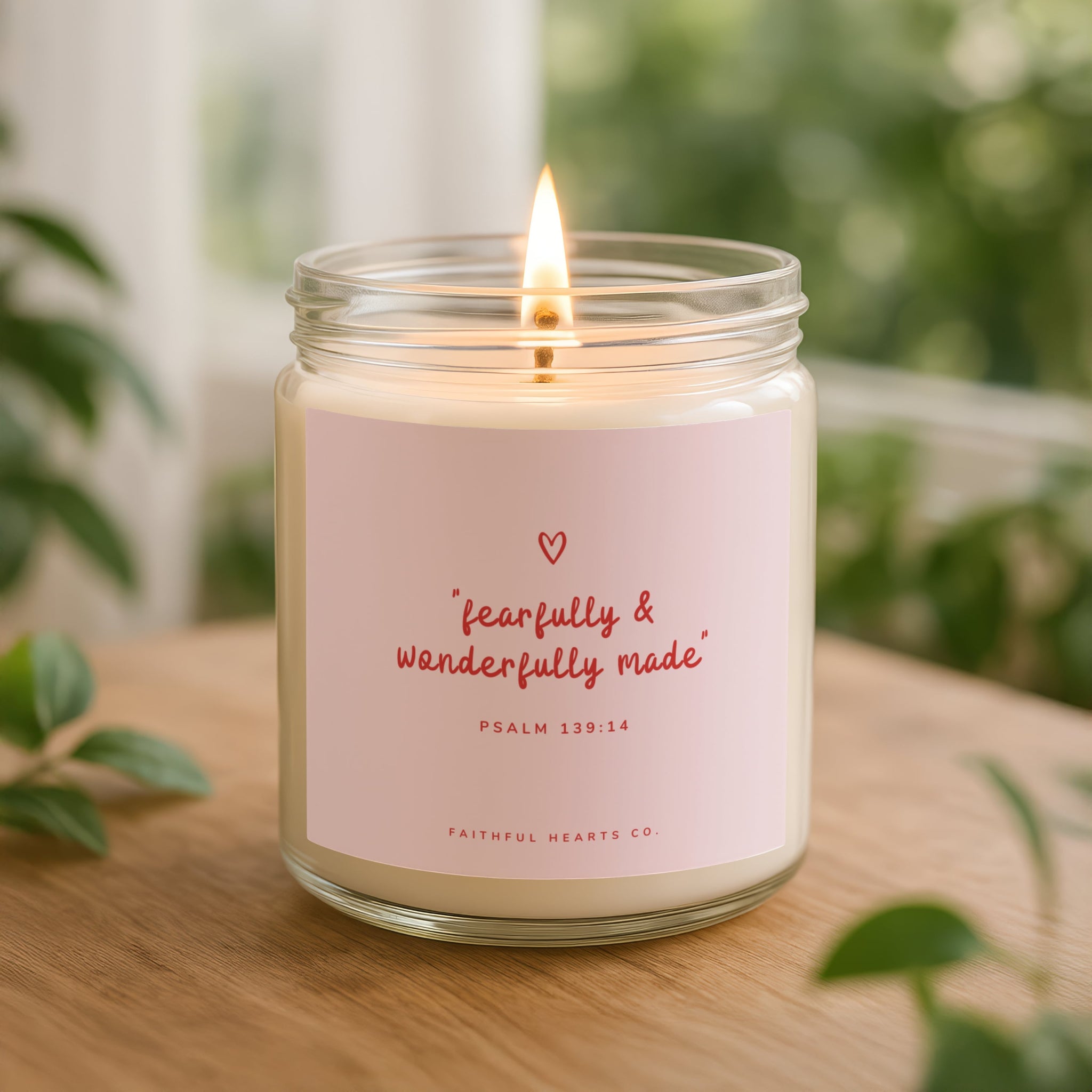 Fearfully and Wonderfully Made Christian candle in clear glass, pink label with red lettering, hand poured wax, USA made faith decor.