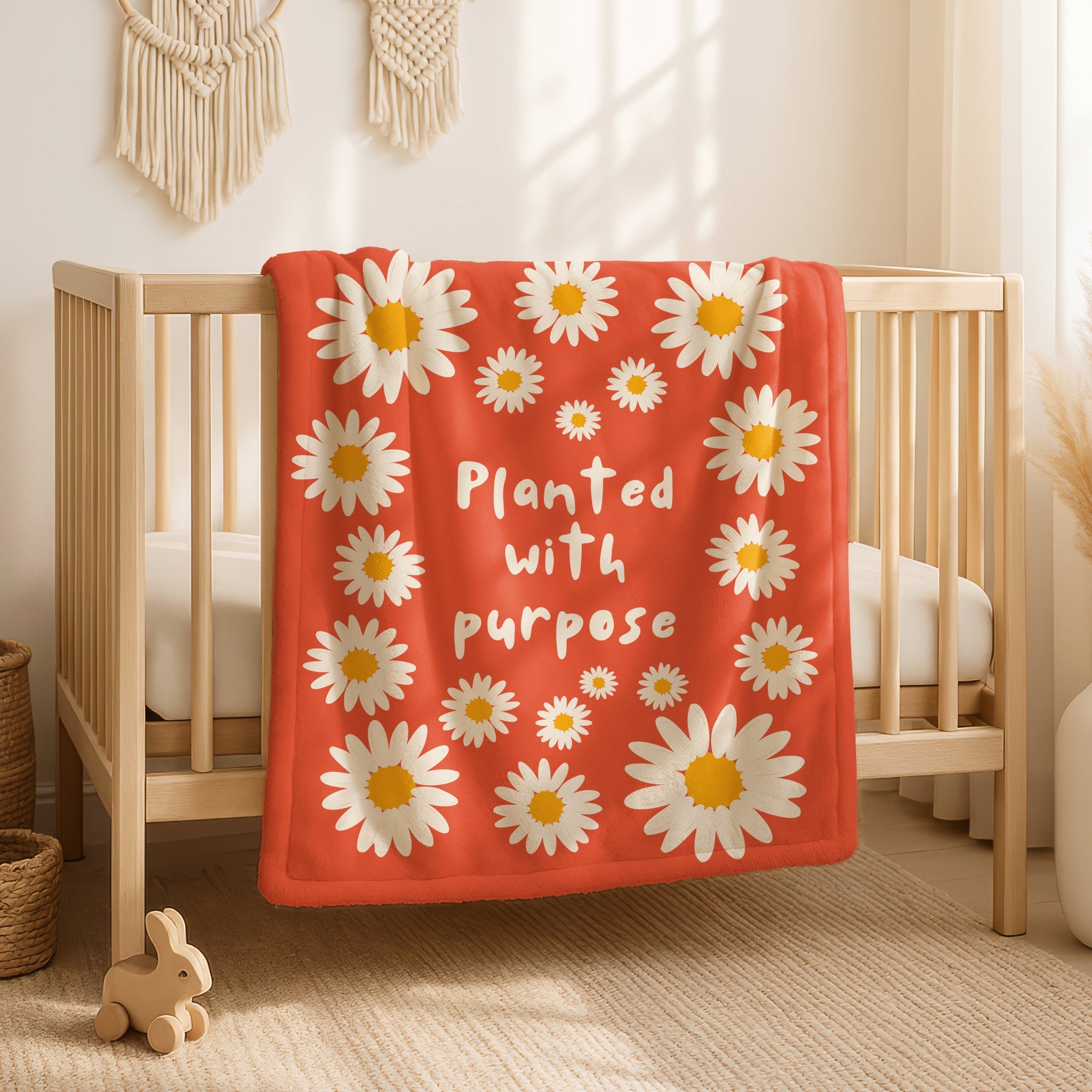 Christian throw blanket in vivid orange with daisy floral design and uplifting message