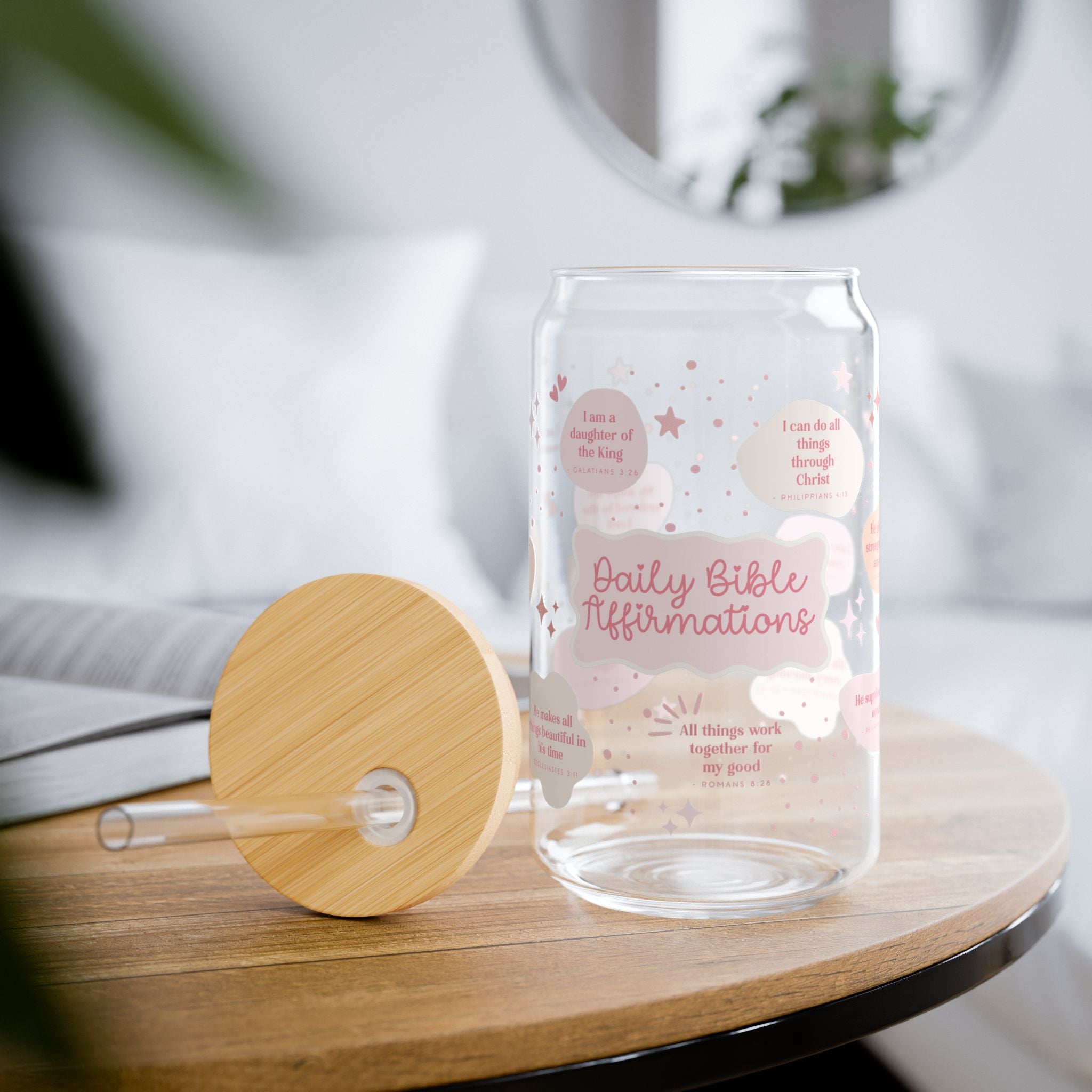 Glass tumbler with wooden lid on a table, featuring 'Daily Bible Affirmations' text.