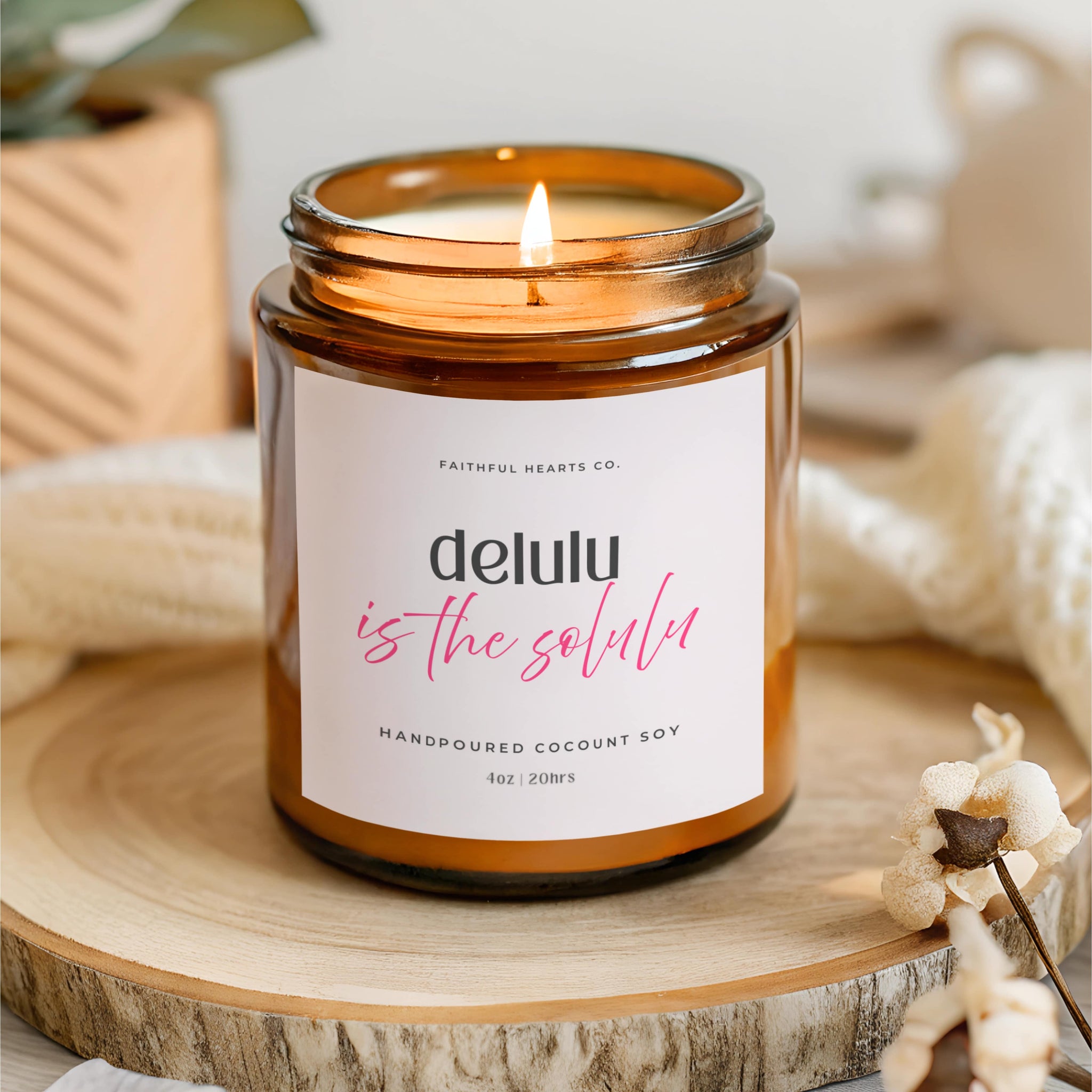 Amber glass Delulu is the Solulu manifestation candle by Faithful Hearts, fun self belief and mindset gift for women embracing soft girl energy.