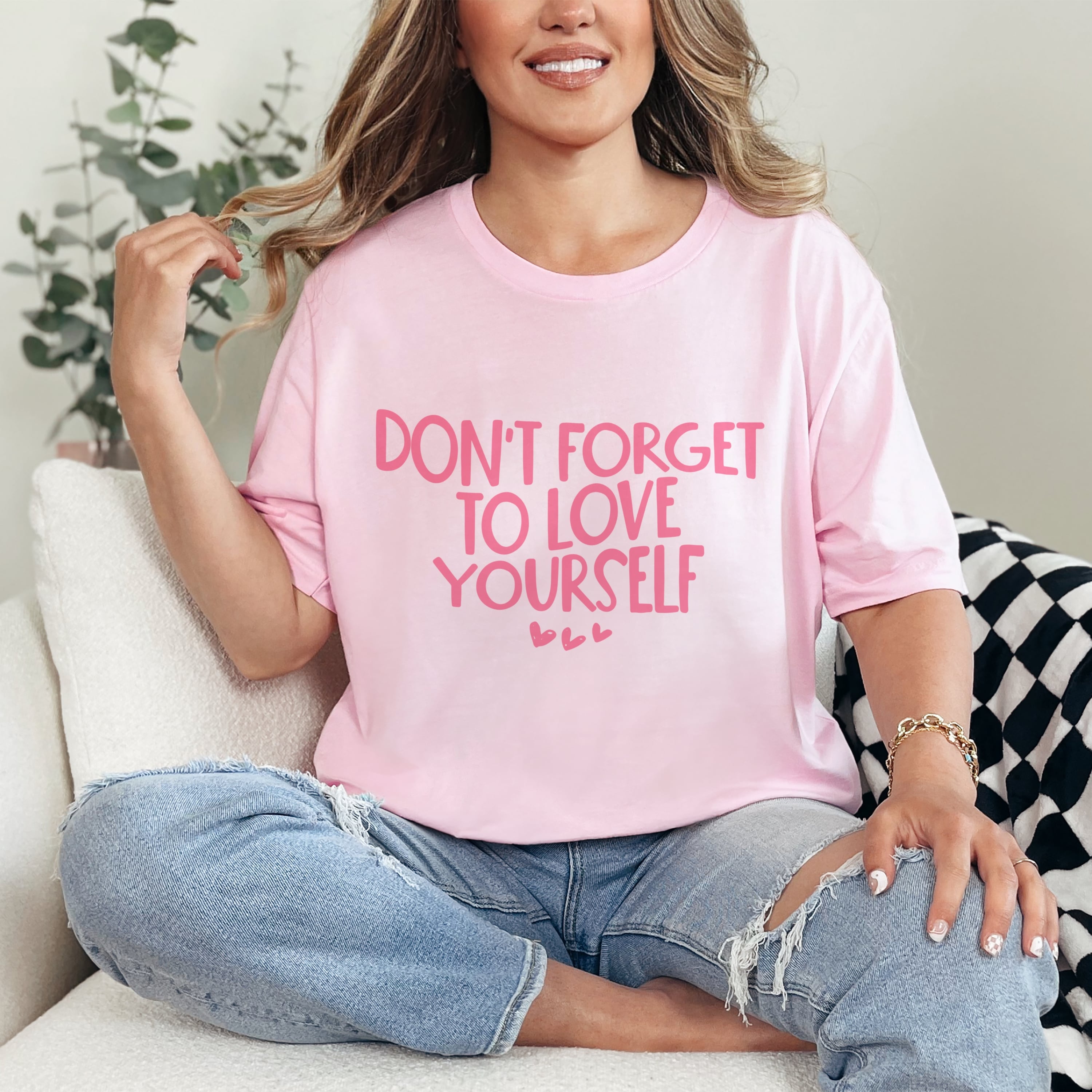 Oversized fit self-love reminder tshirt in pink styled casually with jeans, mental health awareness graphic tee
