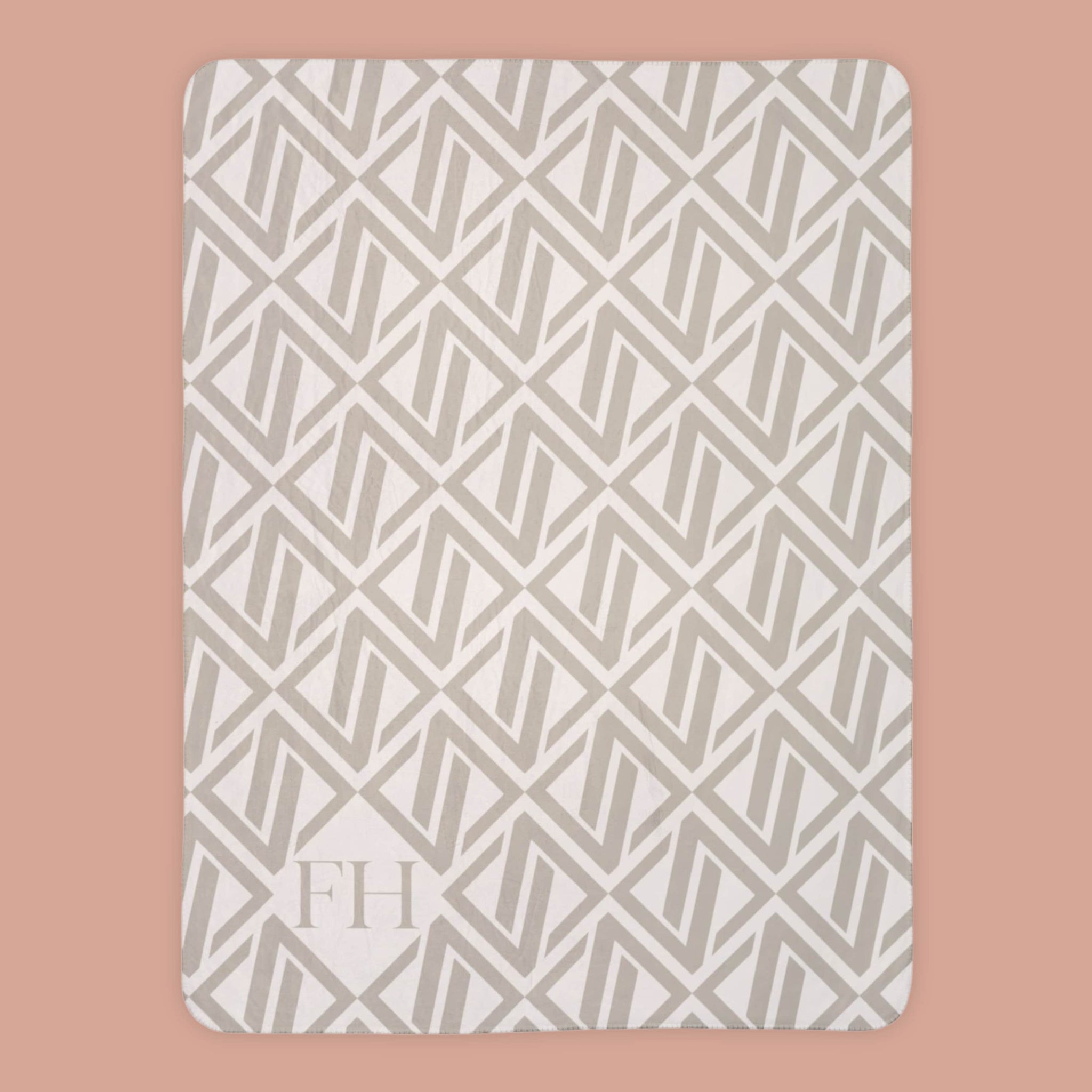 Soft Faithful Hearts branded sherpa throw blanket with subtle geometric pattern lay flat