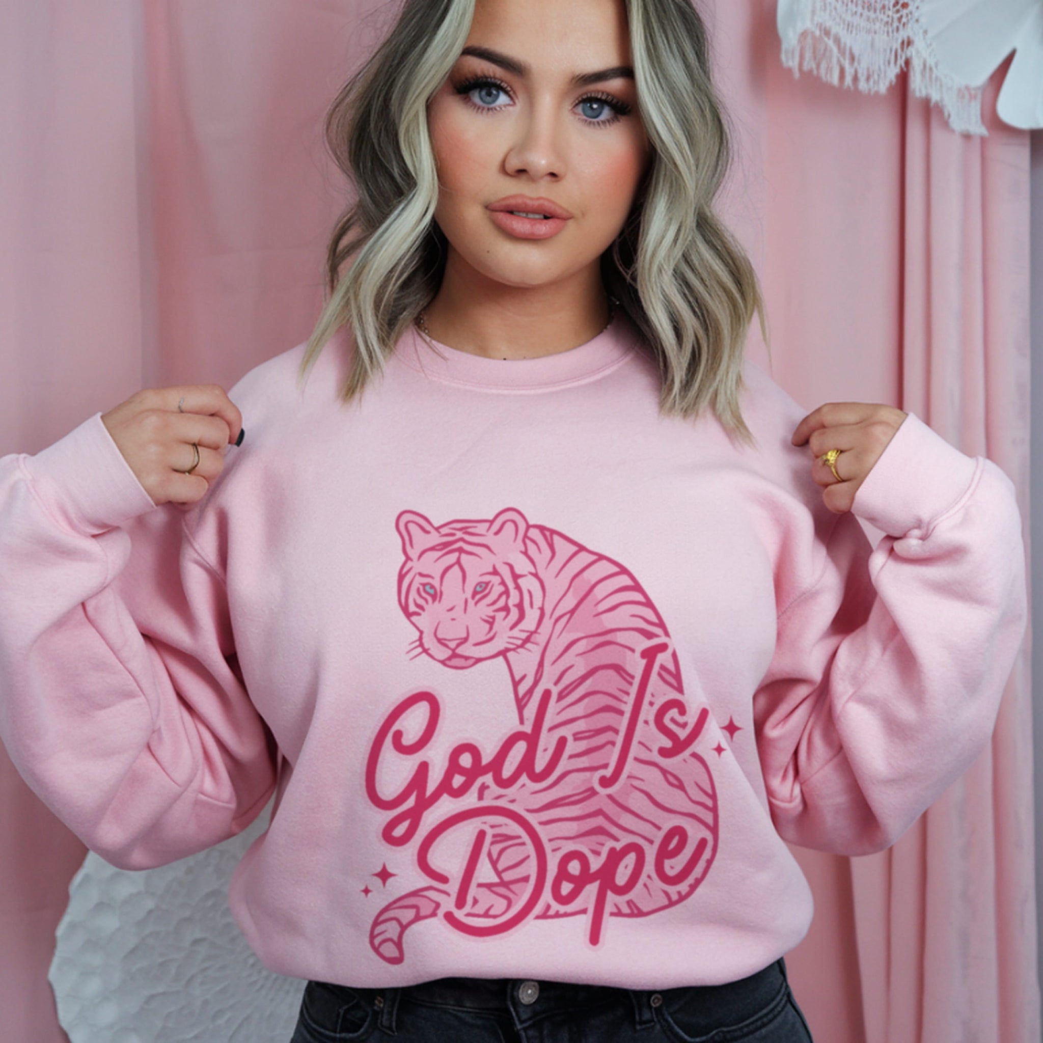 God Is Dope retro script text with pink tiger illustration, trendy Christian streetwear sweatshirt design