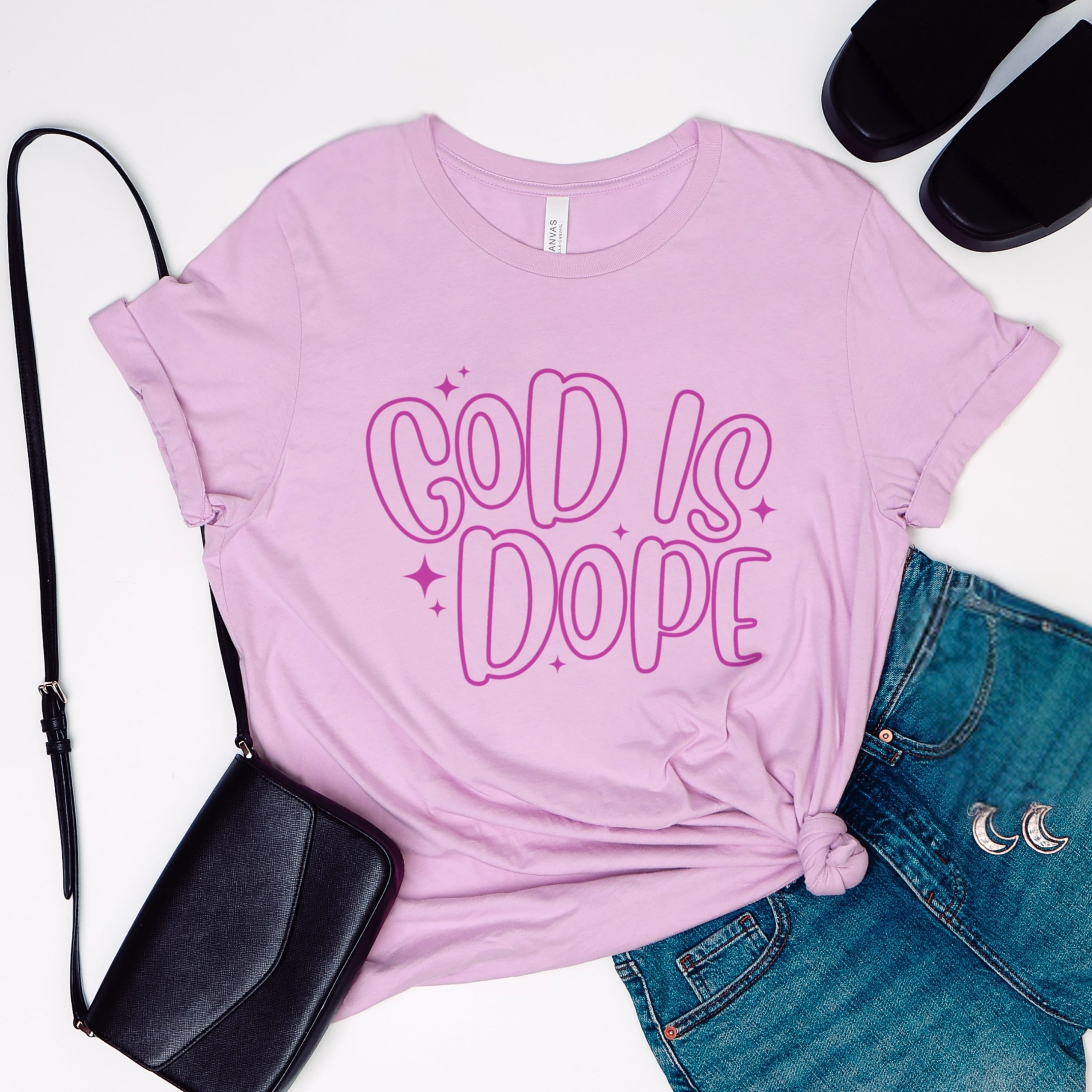 Close up of God Is Dope retro bubble design with stars in purple on lilac cotton tshirt