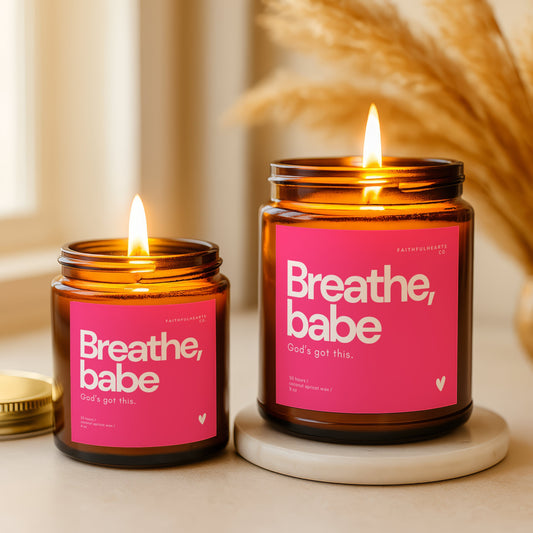 Breathe, babe. God’s got this. affirmation candle in amber glass jar with hot pink label, handmade Christian gift for her promoting faith, calm, and confidence.