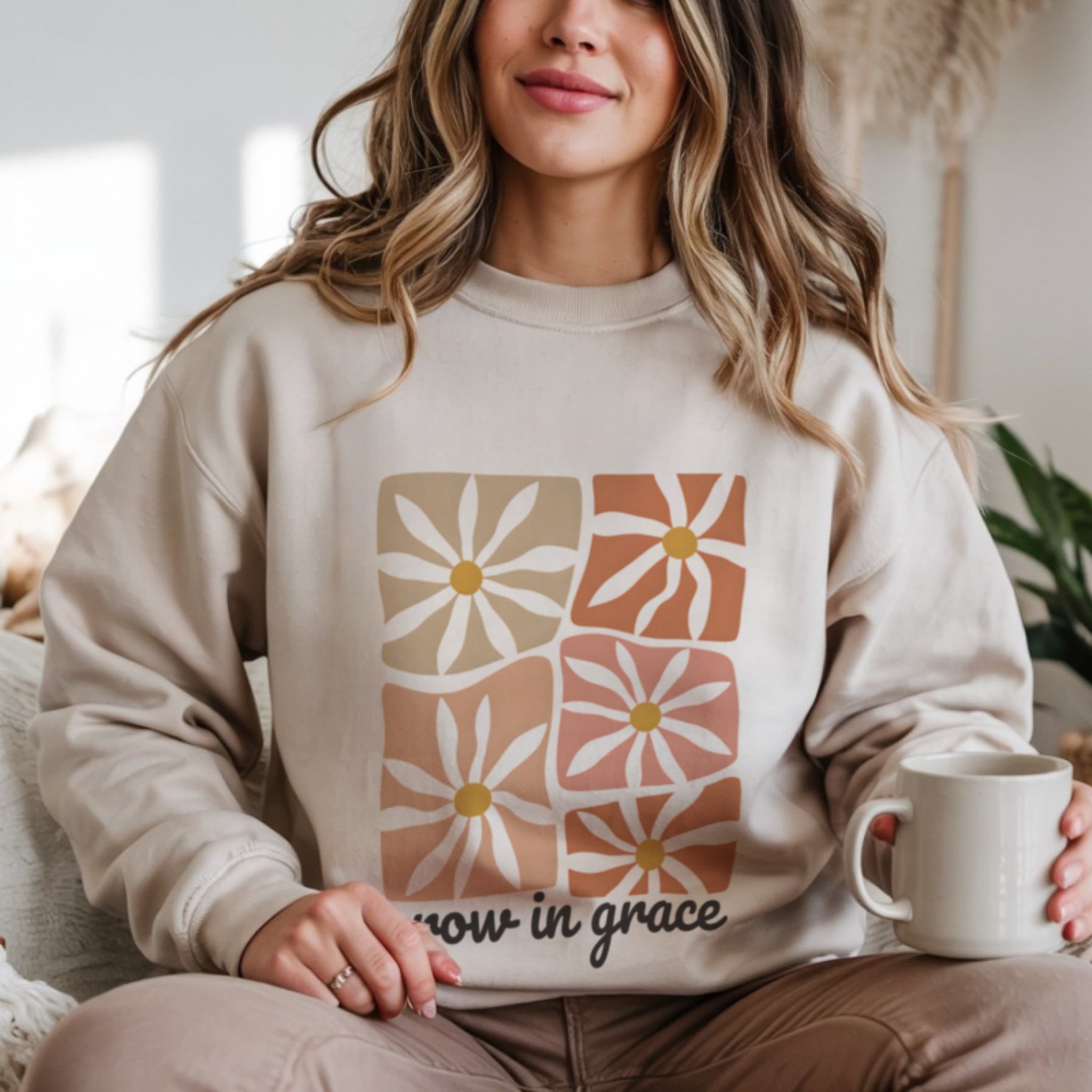 Woman wearing Grow In Grace beige aesthetic crewneck sweatshirt with jeans, soft girl Christian cottagecore fashion