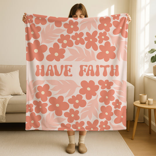 Have Faith retro blanket in coral pink and cream with vintage 70s style flowers and groovy hand-lettered text, featuring boho floral pattern in terracotta, peach, and blush tones
