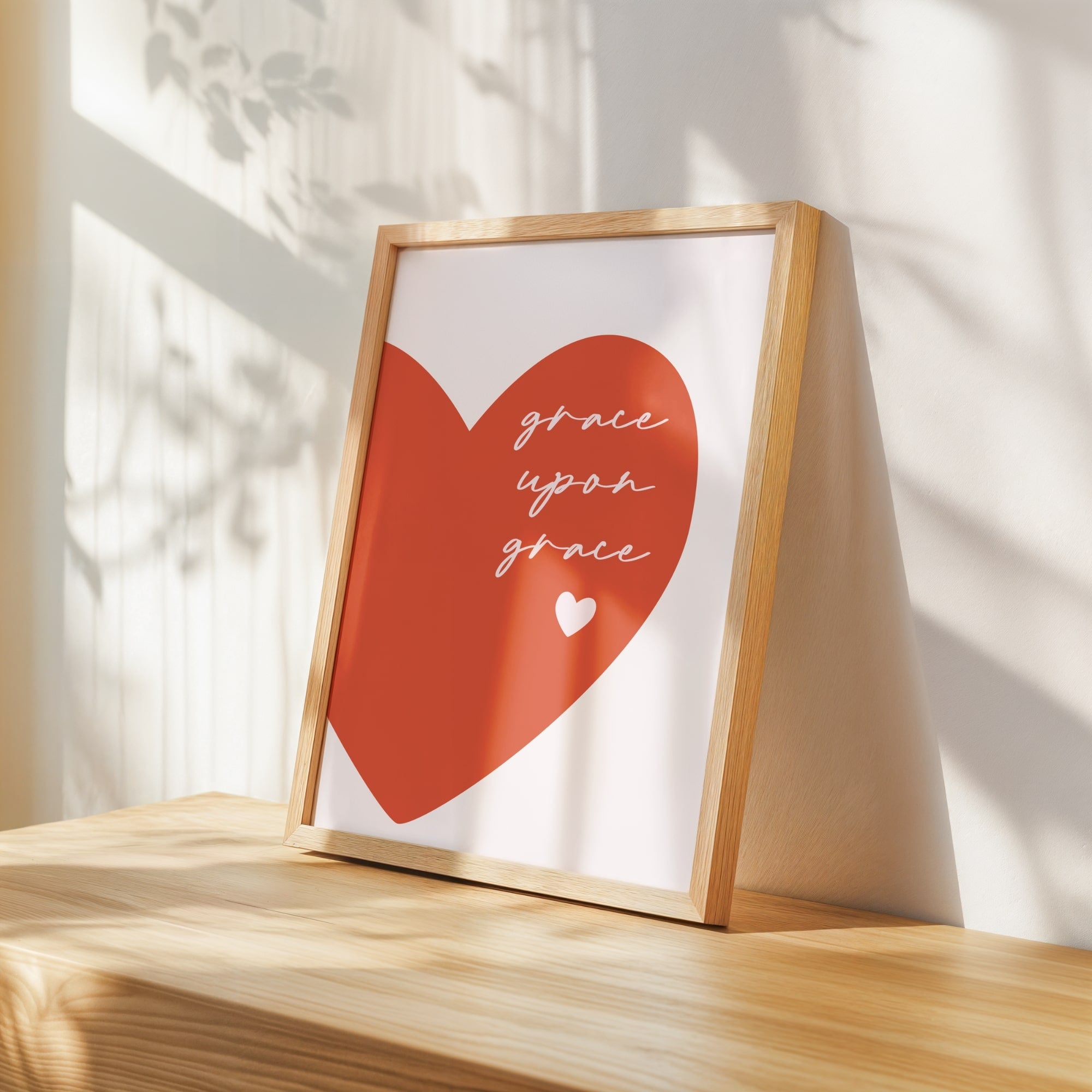 Inspirational Christian wall art featuring a bold coral heart design, perfect faith print for cozy bedrooms, nurseries, or living rooms.