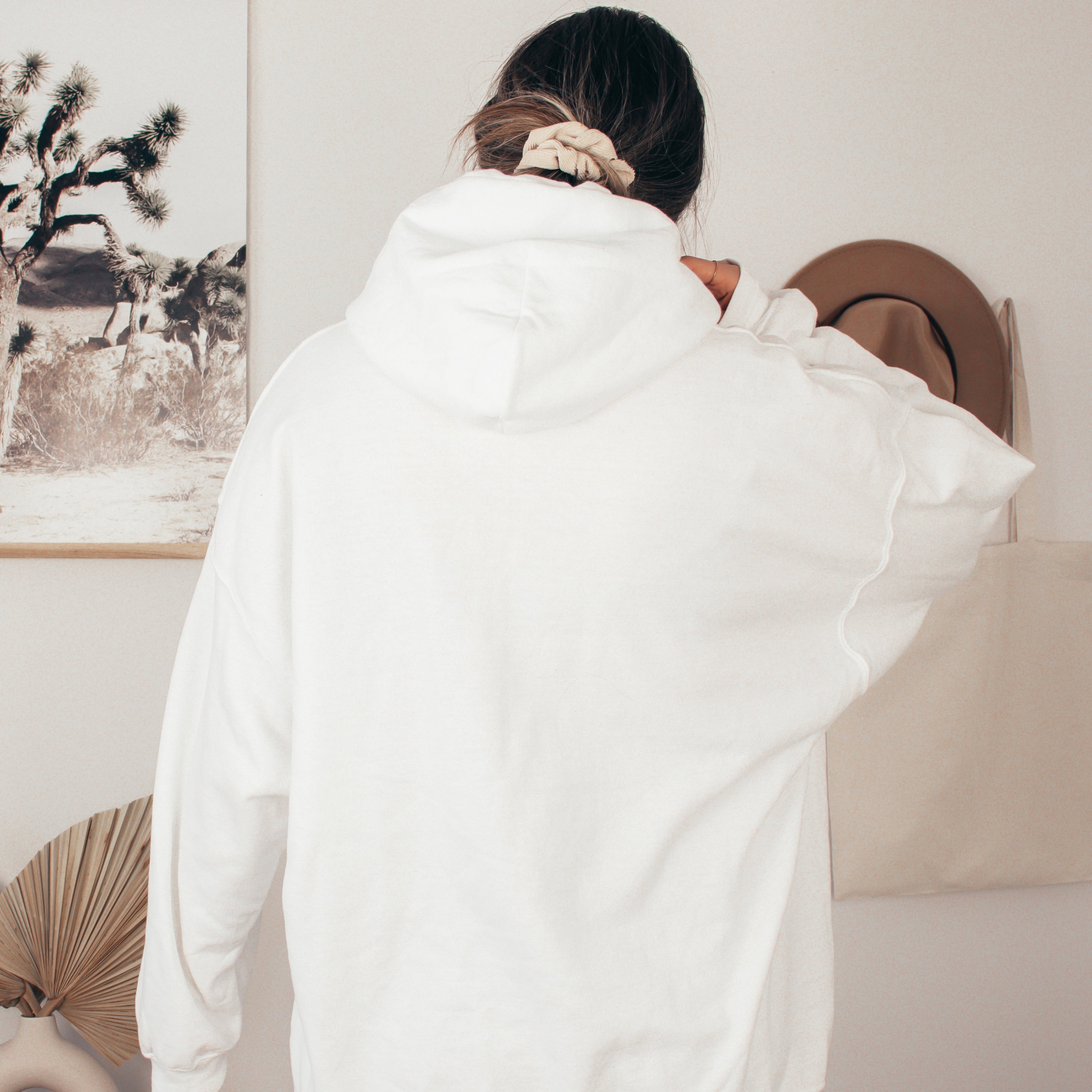 Woman wearing soft life hoodie in white